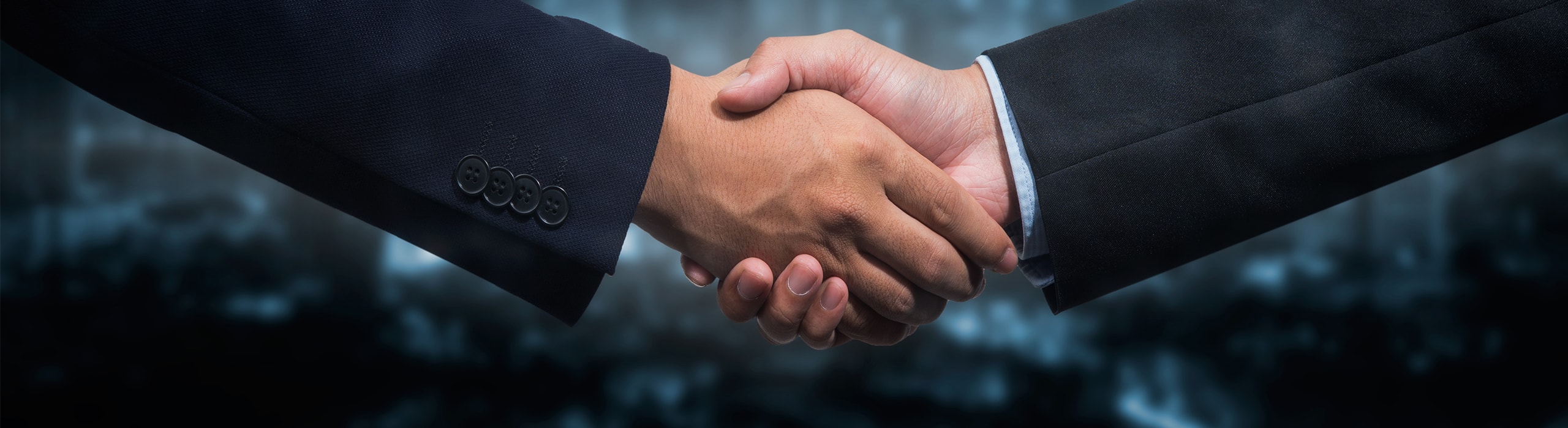 two business brokers shaking hands