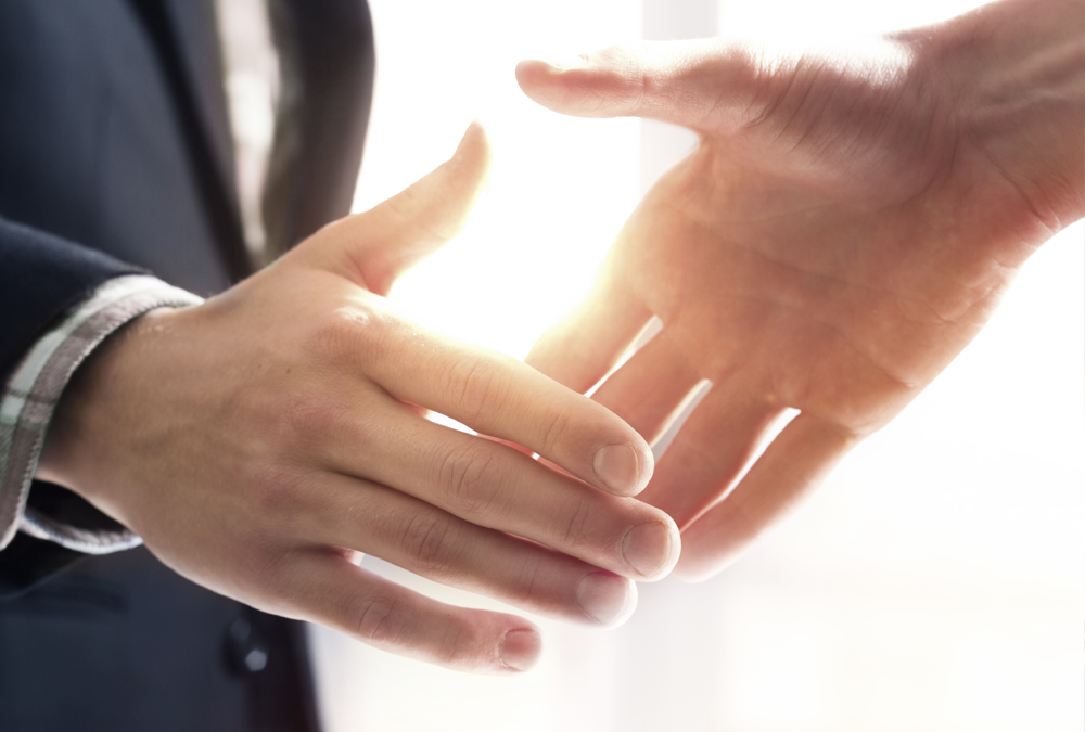two businessmen shaking hands