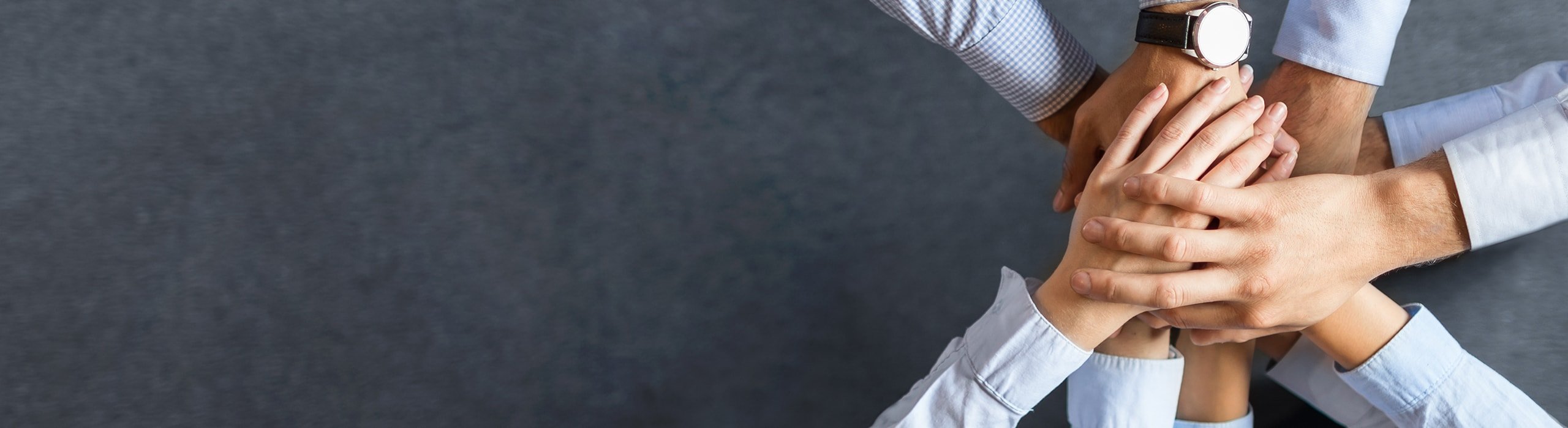 multiple business brokers putting their hands in