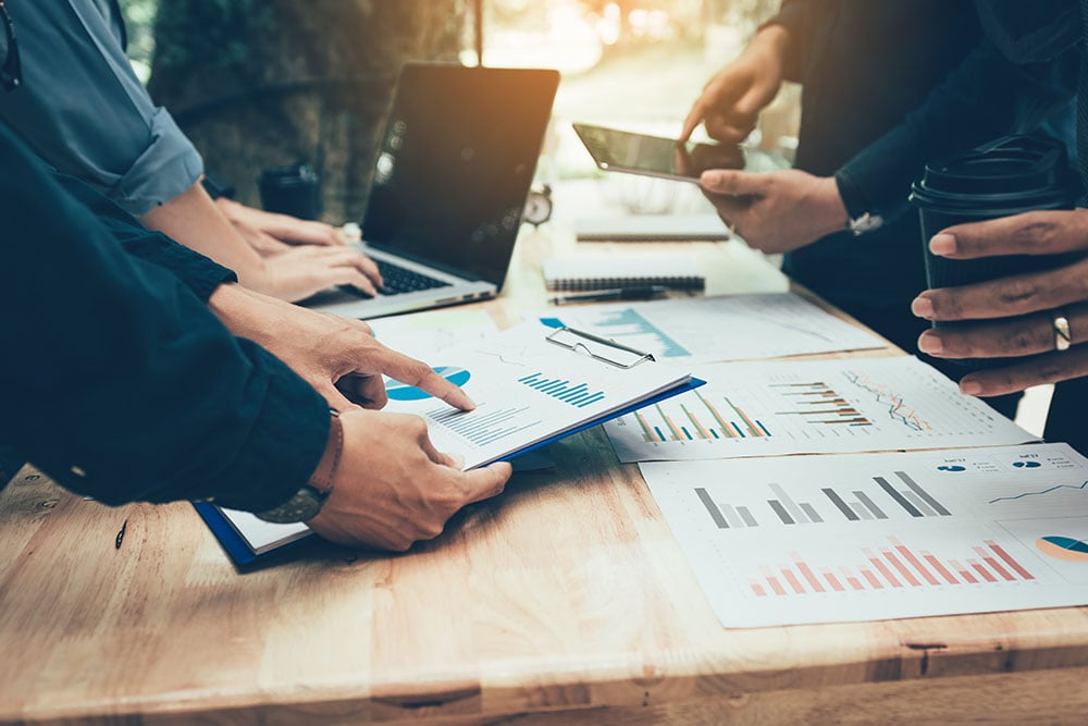 group of members going over information and charts