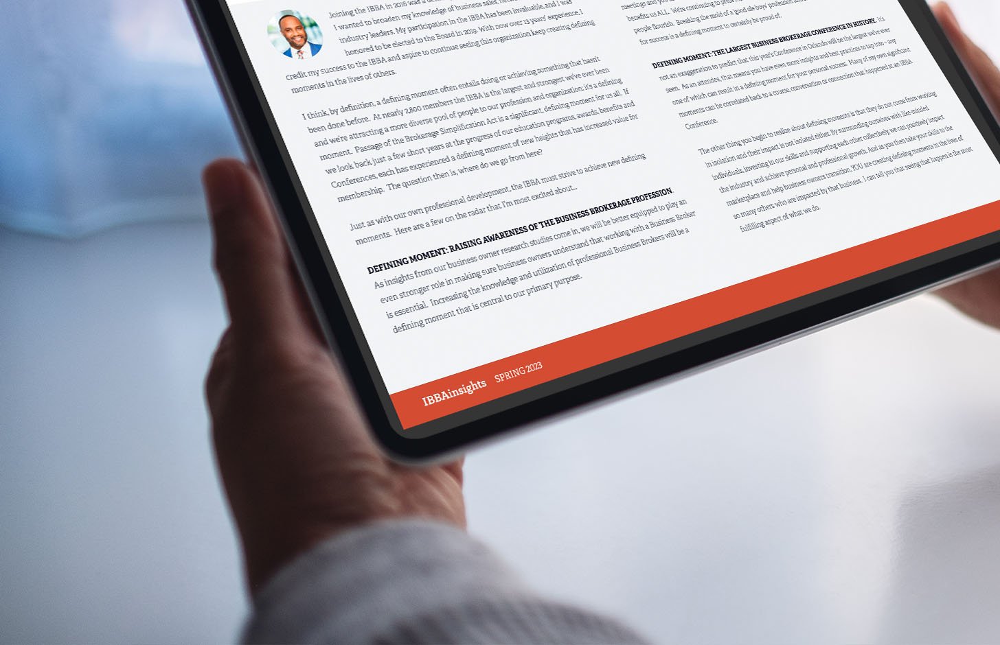 woman reading ibba magazine spring 2023 issue on a tablet