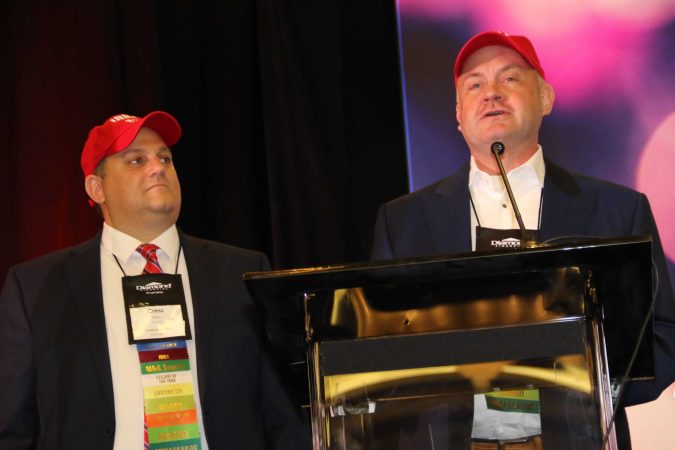 close-up of jeff and cress on stage speaking