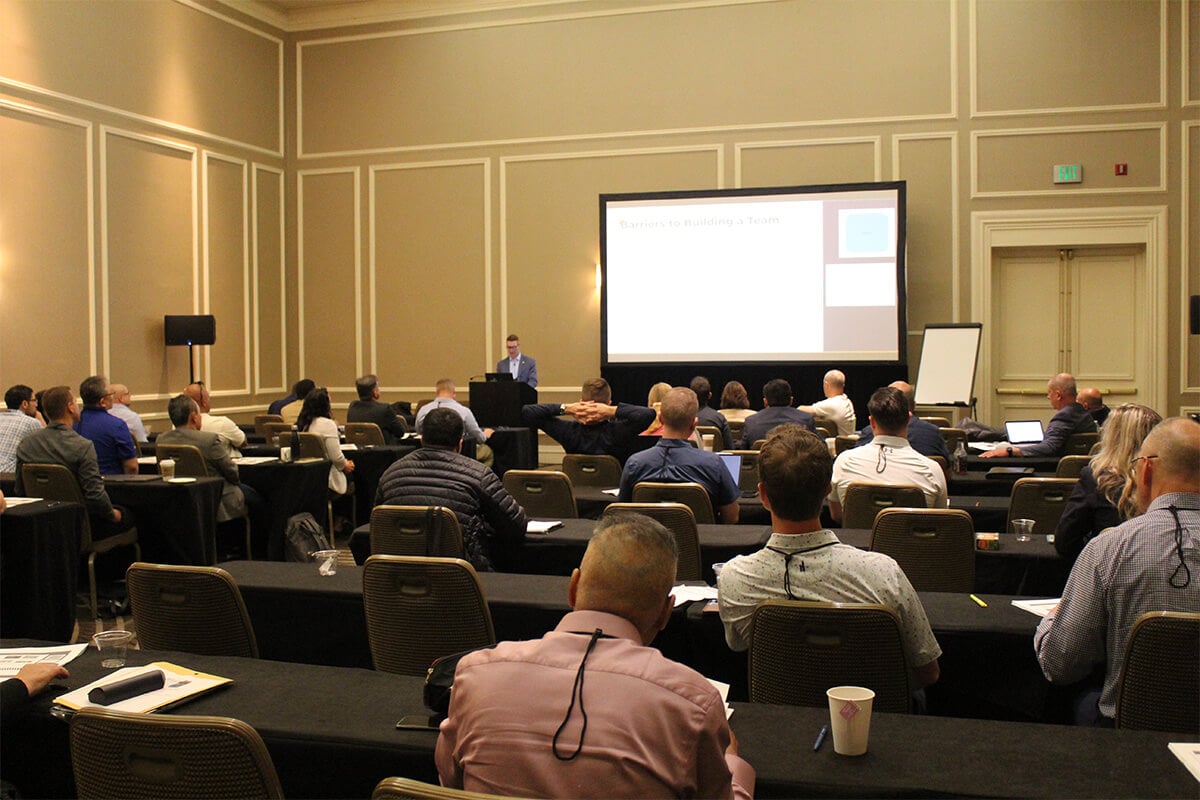 conference attendees listen to a presentation