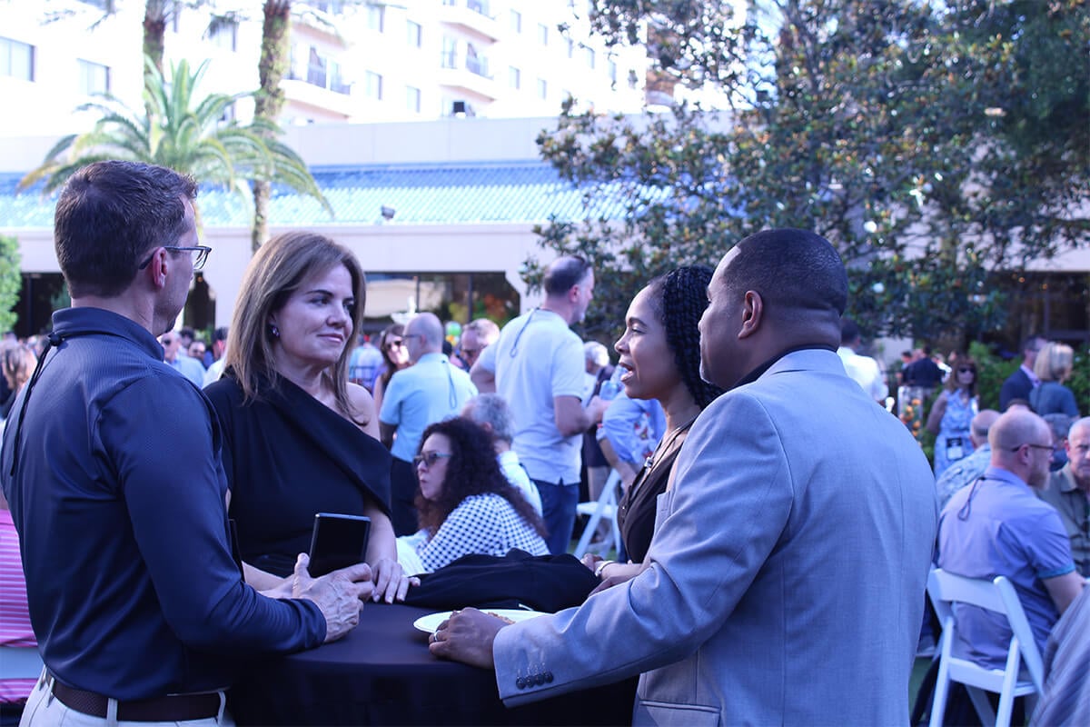 attendees mingle at the conference in orlando