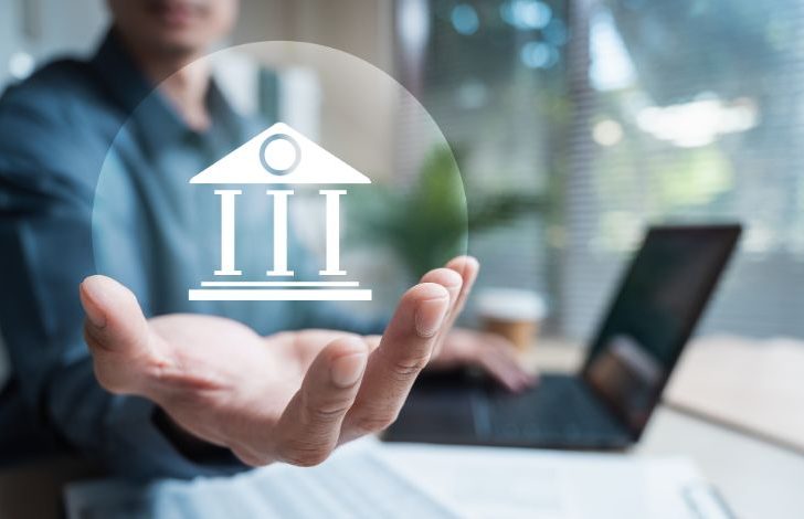 Business professional holding out a hand with a digital government-building icon