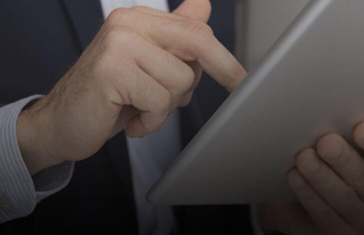 man using technology in business brokerage practice