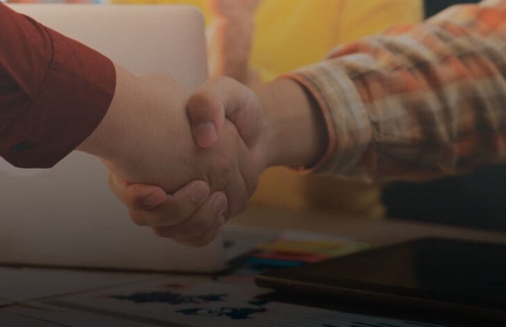 business broker and seller shaking hands