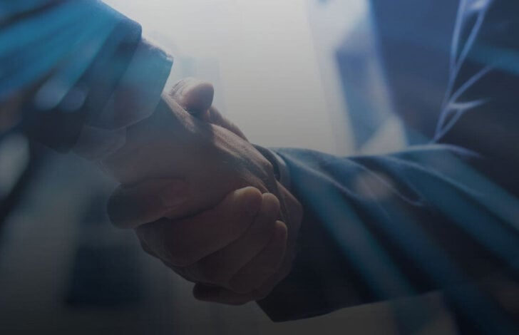 business broker and seller shaking hands