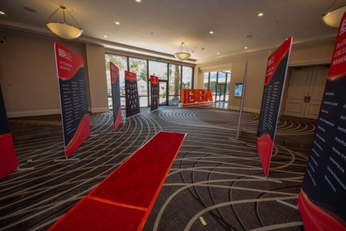 view of the red carpet and award winner banners at the 2025 ibba conference