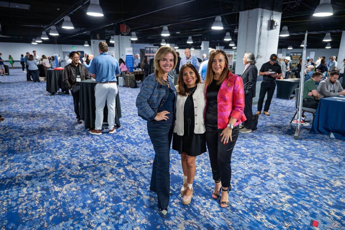 Three attendees pose for a picture at the 2026 IBBA Conference