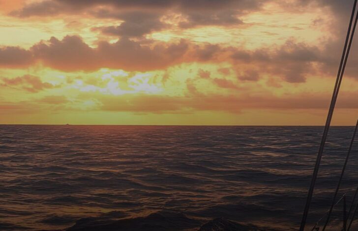 A ship sailing towards the horizon